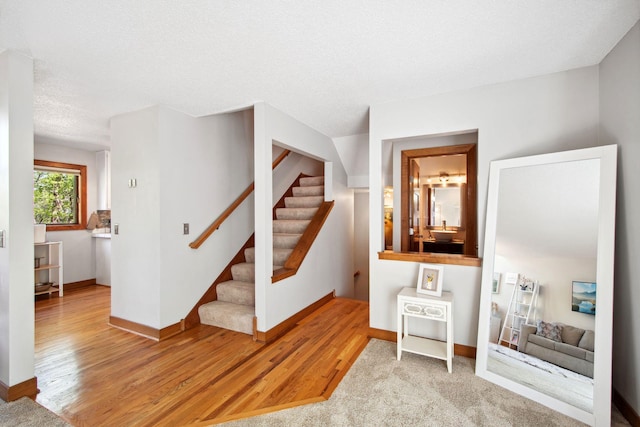 3664 Abbey Way Unit C, Eagan, MN 55123 - stairs with baseboards and wood finished floors