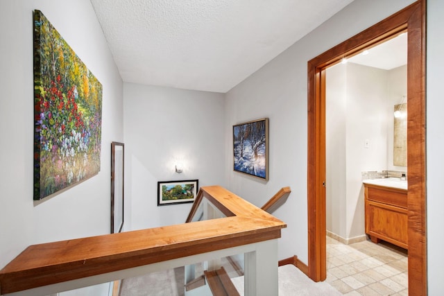 3664 Abbey Way Unit C, Eagan, MN 55123 - hall with an upstairs landing, baseboards, and a textured ceiling