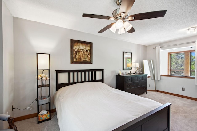 3664 Abbey Way Unit C, Eagan, MN 55123 - bedroom featuring light carpet, baseboards, a ceiling fan, and a textured ceiling
