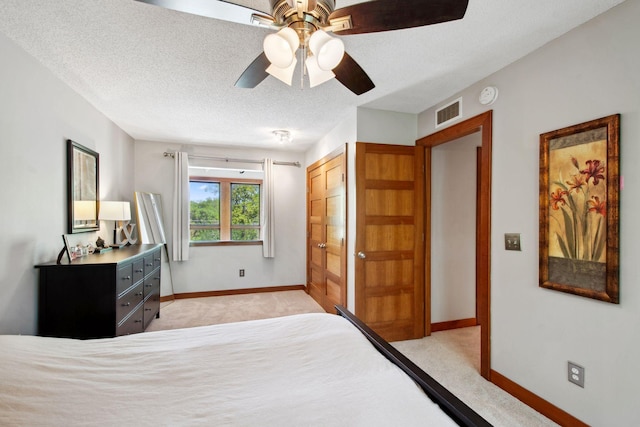 3664 Abbey Way Unit C, Eagan, MN 55123 - bedroom featuring light colored carpet, baseboards, a closet, a ceiling fan, and a textured ceiling
