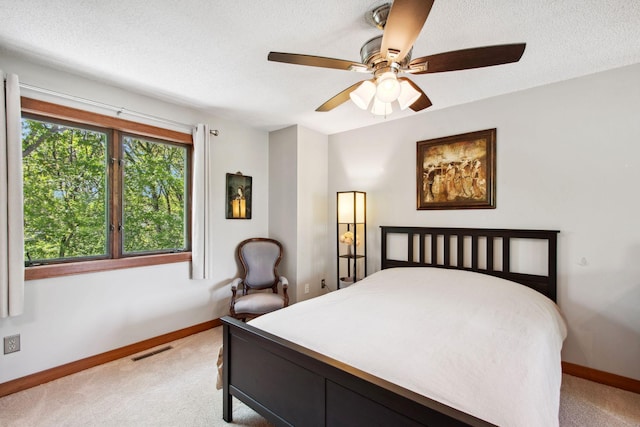 3664 Abbey Way Unit C, Eagan, MN 55123 - bedroom with light colored carpet, baseboards, a textured ceiling, and ceiling fan
