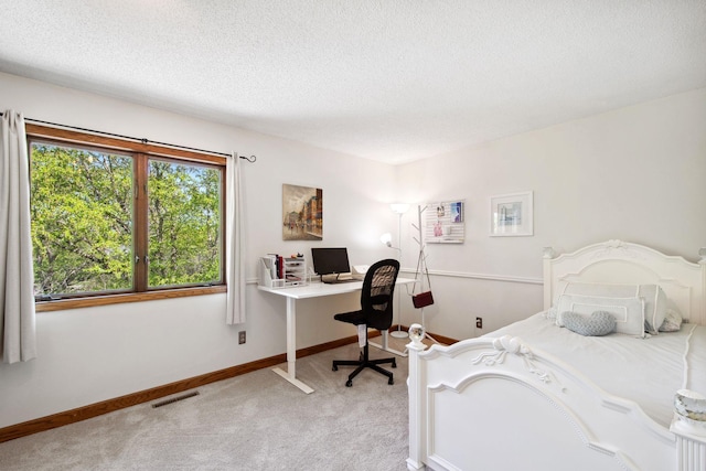 3664 Abbey Way Unit C, Eagan, MN 55123 - bedroom featuring light carpet, a textured ceiling, a desk, and baseboards