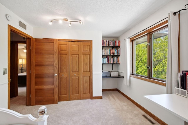 3664 Abbey Way Unit C, Eagan, MN 55123 - office area featuring light colored carpet, a textured ceiling, and baseboards