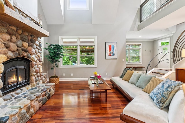 16710 Edgewood Ave, Wayzata, MN 55391 - living area with a high ceiling, wood finished floors, and a stone fireplace