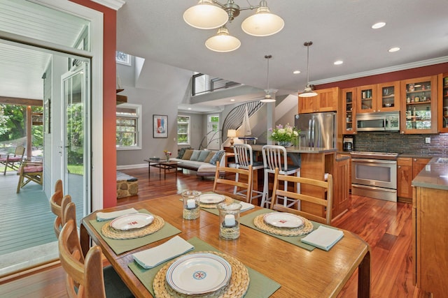 16710 Edgewood Ave, Wayzata, MN 55391 - dining room featuring wood finished floors, recessed lighting, and a chandelier