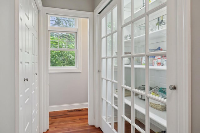 16710 Edgewood Ave, Wayzata, MN 55391 - doorway featuring baseboards and wood finished floors