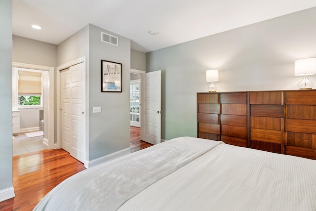 16710 Edgewood Ave, Wayzata, MN 55391 - bedroom with wood finished floors, a closet, and recessed lighting