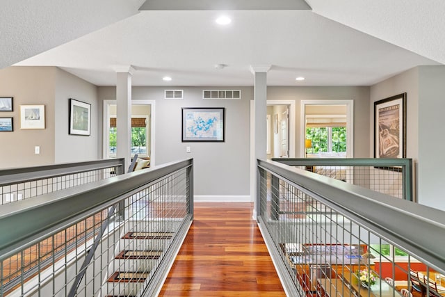 16710 Edgewood Ave, Wayzata, MN 55391 - hall with an upstairs landing, wood finished floors, and recessed lighting