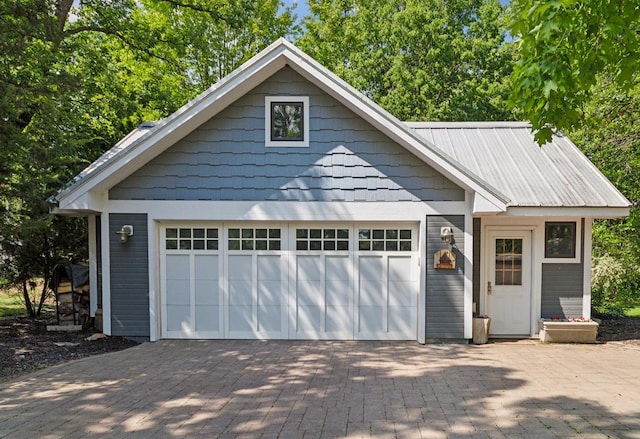 16710 Edgewood Ave, Wayzata, MN 55391 - view of front of property featuring an outbuilding, a garage, and driveway