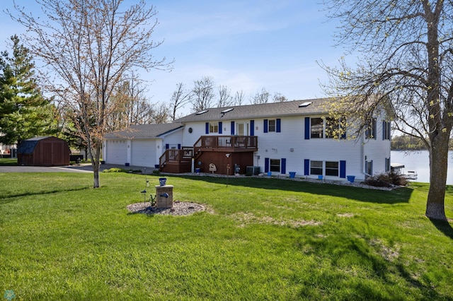 15344 Blackhawk Rd, Lake Eunice Twp, MN 56511 - rear view of property featuring a storage unit, an outbuilding, cooling unit, driveway, and a deck
