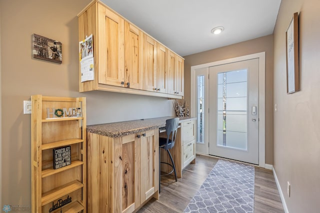 15344 Blackhawk Rd, Lake Eunice Twp, MN 56511 - doorway to outside with wood finished floors and baseboards