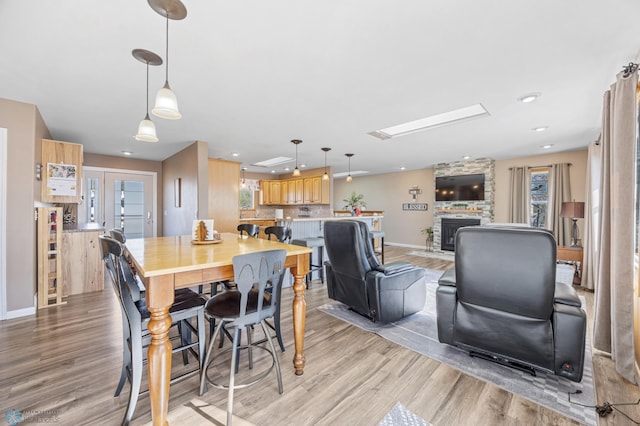 15344 Blackhawk Rd, Lake Eunice Twp, MN 56511 - dining area with light wood finished floors, baseboards, and recessed lighting