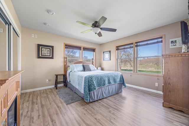 15344 Blackhawk Rd, Lake Eunice Twp, MN 56511 - bedroom featuring light wood-type flooring, baseboards, a ceiling fan, and a closet