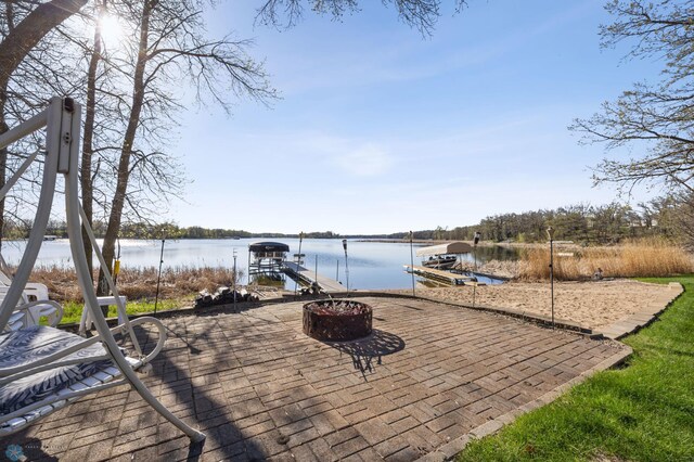 15344 Blackhawk Rd, Lake Eunice Twp, MN 56511 - view of patio / terrace with a dock, a water view, and boat lift