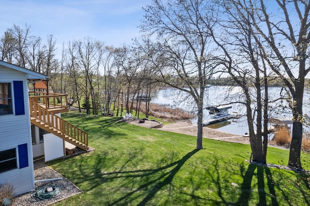 15344 Blackhawk Rd, Lake Eunice Twp, MN 56511 - view of green lawn with stairway and a deck with water view