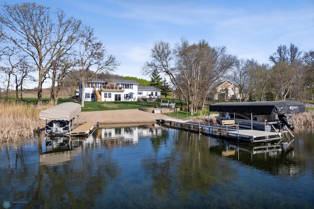15344 Blackhawk Rd, Lake Eunice Twp, MN 56511 - dock area with boat lift, a water view, and a lawn