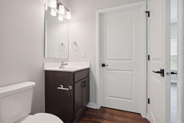 2219 Youngman Ave, Saint Paul, MN 55116 - half bath with toilet, vanity, and wood finished floors