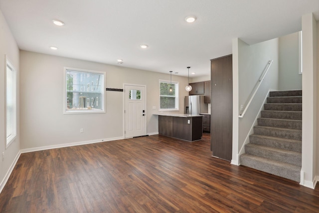 2219 Youngman Ave, Saint Paul, MN 55116 - unfurnished living room with baseboards, stairway, dark wood finished floors, and recessed lighting