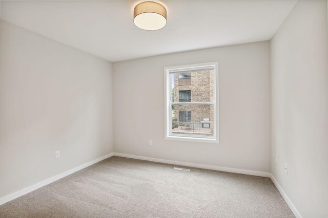 2219 Youngman Ave, Saint Paul, MN 55116 - empty room with baseboards, visible vents, and carpet floors