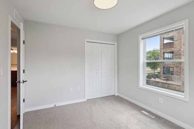 2219 Youngman Ave, Saint Paul, MN 55116 - unfurnished bedroom with a closet, baseboards, and visible vents