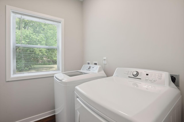 2219 Youngman Ave, Saint Paul, MN 55116 - washroom with washing machine and dryer, laundry area, and baseboards