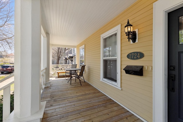 wooden terrace featuring a porch