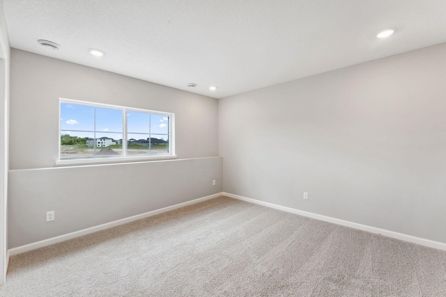 6742 Wildflower Way, Minnetrista, MN 55331 - empty room featuring carpet floors, recessed lighting, and a smoke detector