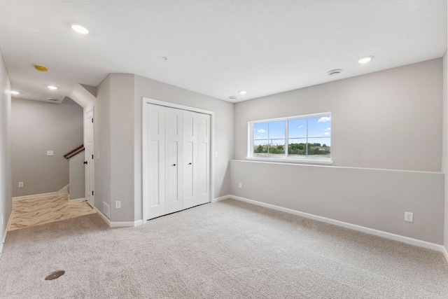 6742 Wildflower Way, Minnetrista, MN 55331 - unfurnished bedroom featuring carpet floors, a closet, and recessed lighting