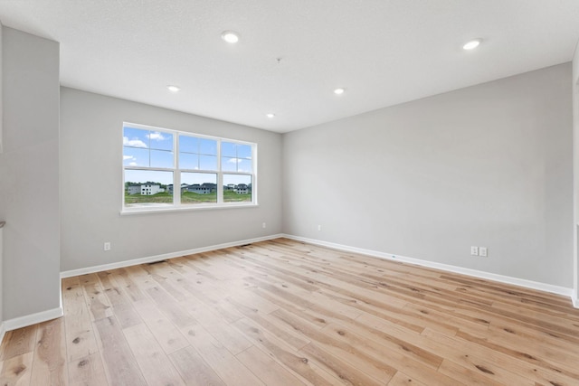 6742 Wildflower Way, Minnetrista, MN 55331 - unfurnished room featuring light wood-type flooring and recessed lighting
