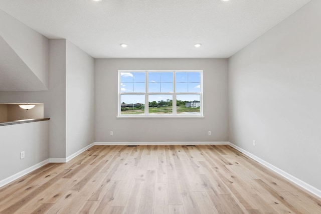 6742 Wildflower Way, Minnetrista, MN 55331 - spare room with light wood-type flooring and recessed lighting