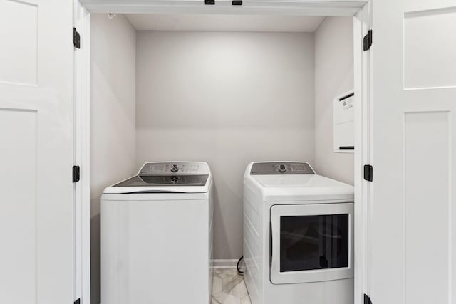 6742 Wildflower Way, Minnetrista, MN 55331 - washroom featuring light marble finish floors and washer and clothes dryer