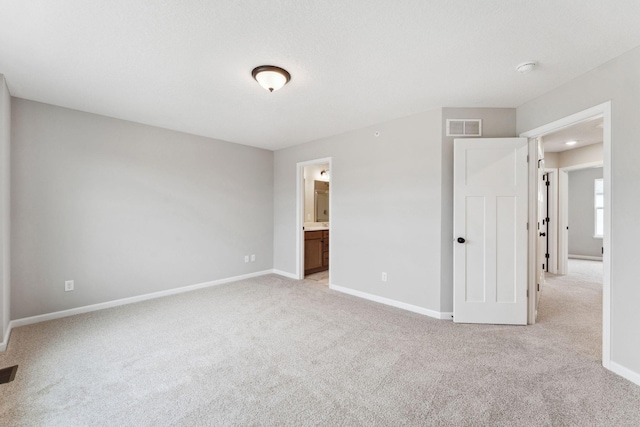 6742 Wildflower Way, Minnetrista, MN 55331 - unfurnished bedroom with light carpet and ensuite bathroom