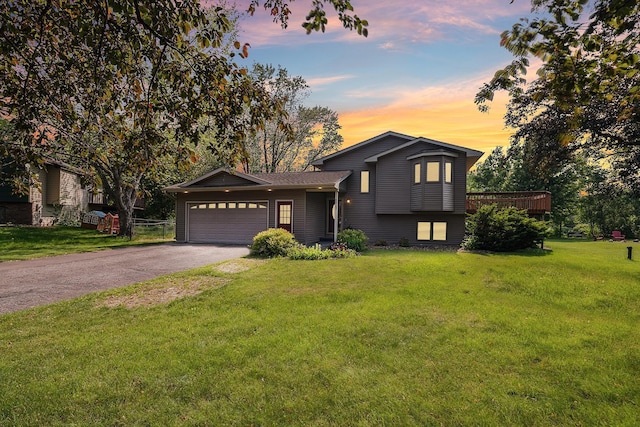 6913 Sumac Ct, Centerville, MN 55038 - tri-level home with driveway, an attached garage, and a front lawn
