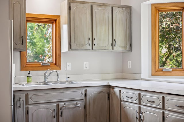 6913 Sumac Ct, Centerville, MN 55038 - kitchen with light countertops, plenty of natural light, and gray cabinetry