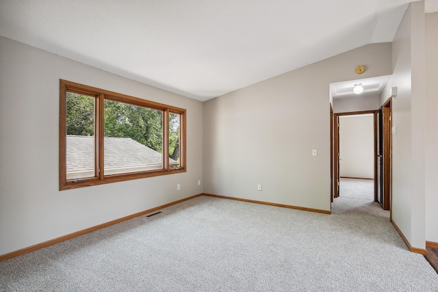 6913 Sumac Ct, Centerville, MN 55038 - empty room with light carpet and vaulted ceiling
