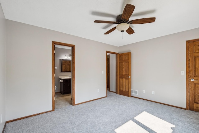 6913 Sumac Ct, Centerville, MN 55038 - unfurnished bedroom with light colored carpet, ensuite bathroom, and ceiling fan