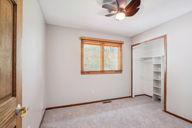 6913 Sumac Ct, Centerville, MN 55038 - unfurnished bedroom with light carpet, a closet, a ceiling fan, and a textured ceiling