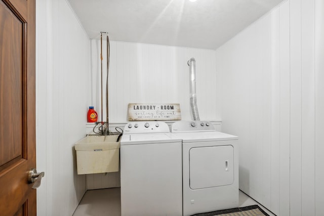 6913 Sumac Ct, Centerville, MN 55038 - laundry area with washing machine and clothes dryer and wood walls