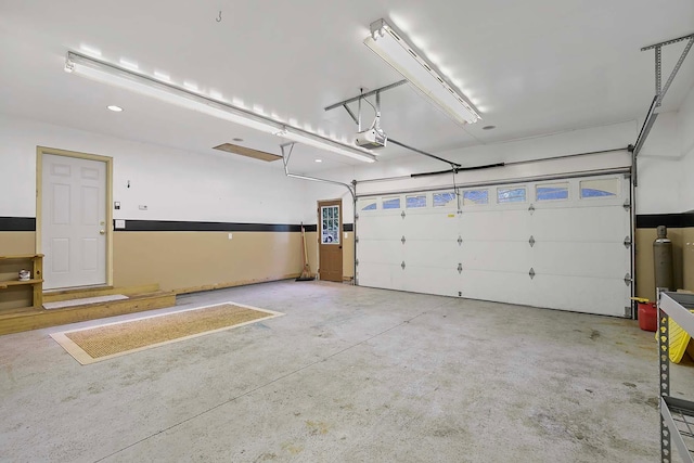 6913 Sumac Ct, Centerville, MN 55038 - garage featuring a garage door opener and recessed lighting