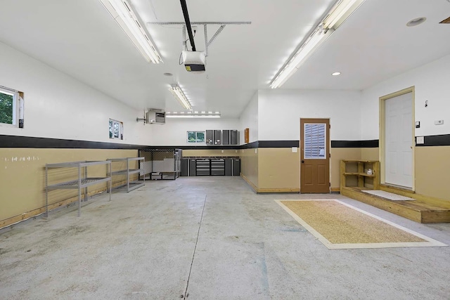 6913 Sumac Ct, Centerville, MN 55038 - garage with a garage door opener, a heating unit, and recessed lighting