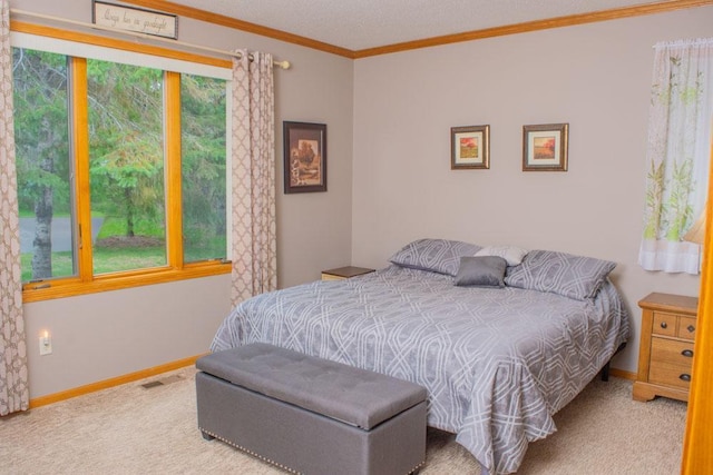 bedroom featuring carpet flooring, ornamental molding, and baseboards