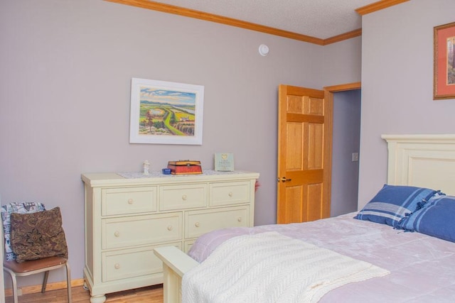 bedroom with crown molding and light wood-type flooring