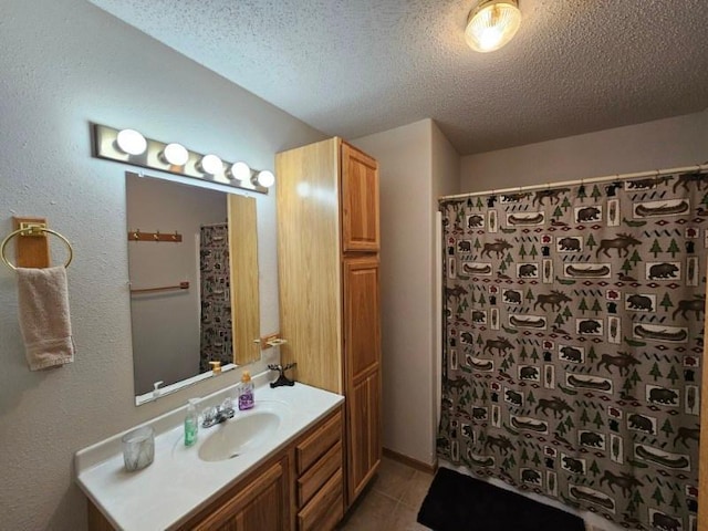 19319 Elsie Way NW, Bemidji, MN 56601 - full bathroom with vanity, a textured ceiling, a shower with curtain, and tile patterned flooring