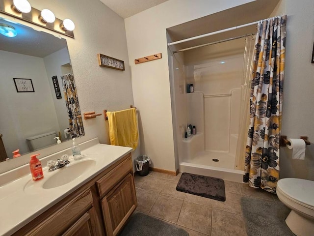 19319 Elsie Way NW, Bemidji, MN 56601 - full bathroom featuring a shower with curtain, toilet, baseboards, tile patterned flooring, and vanity