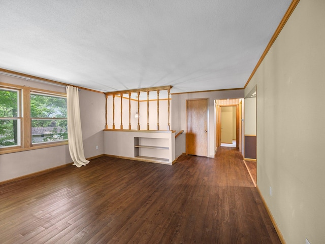 1716 9th Ave SE, Saint Cloud, MN 56304 - unfurnished living room with dark wood-style flooring, baseboards, and ornamental molding