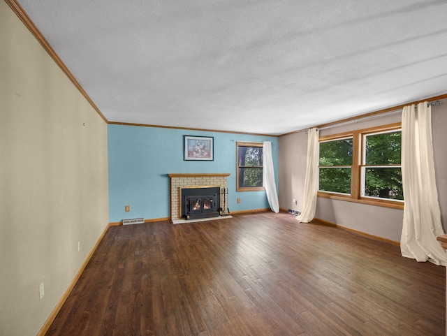 1716 9th Ave SE, Saint Cloud, MN 56304 - unfurnished living room with ornamental molding, baseboards, a fireplace, wood finished floors, and a textured ceiling