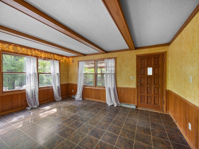 1716 9th Ave SE, Saint Cloud, MN 56304 - entryway with a textured ceiling, a wainscoted wall, wooden walls, and a baseboard radiator