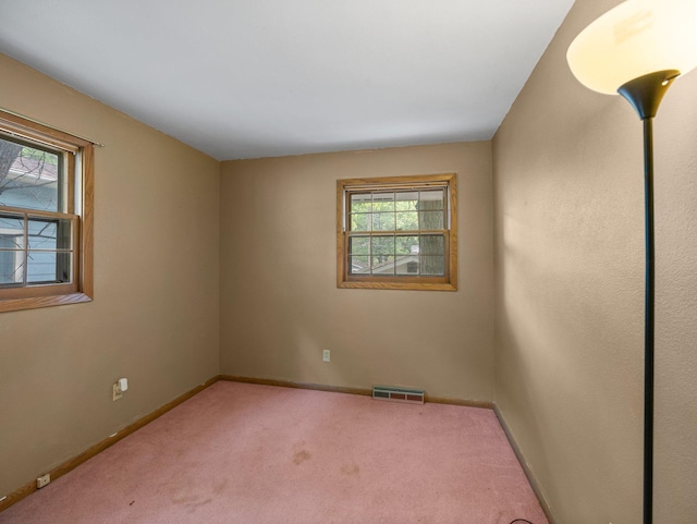 1716 9th Ave SE, Saint Cloud, MN 56304 - carpeted spare room featuring baseboards