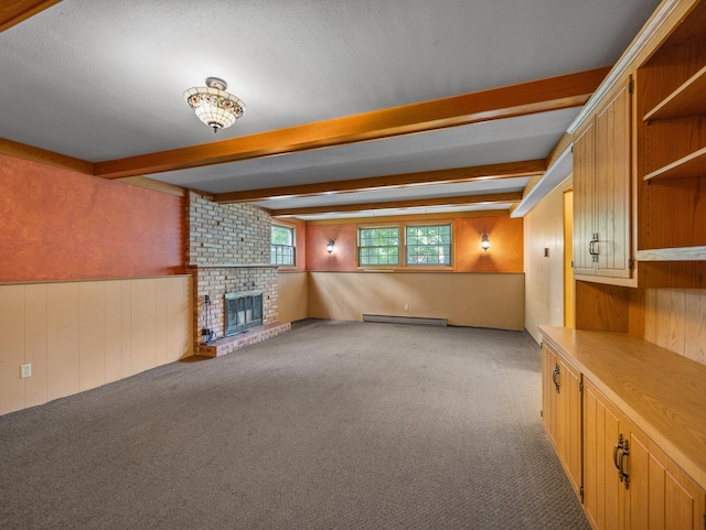 1716 9th Ave SE, Saint Cloud, MN 56304 - unfurnished living room with a baseboard radiator, beam ceiling, wooden walls, carpet flooring, and a fireplace