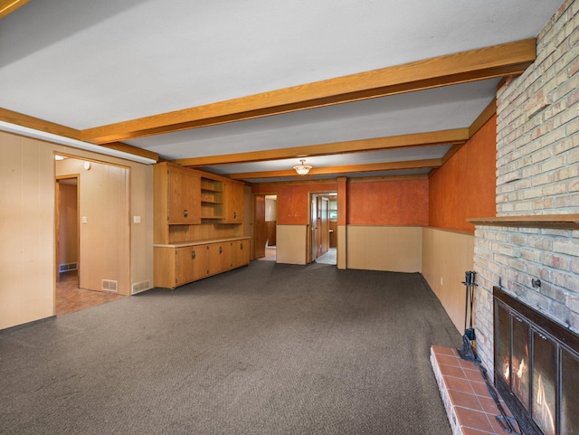 1716 9th Ave SE, Saint Cloud, MN 56304 - unfurnished living room featuring beamed ceiling, a fireplace, and dark carpet